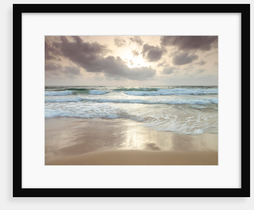 Tranquil beach with cloudscape by Assaf Frank